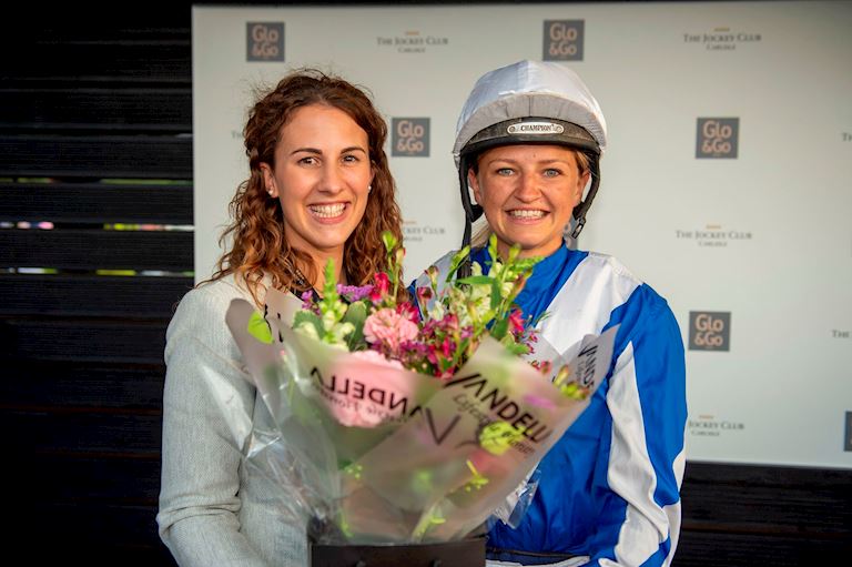 (7) Molly Dingwall presents flowers to Emma Sayer ahead of her final race.jpg