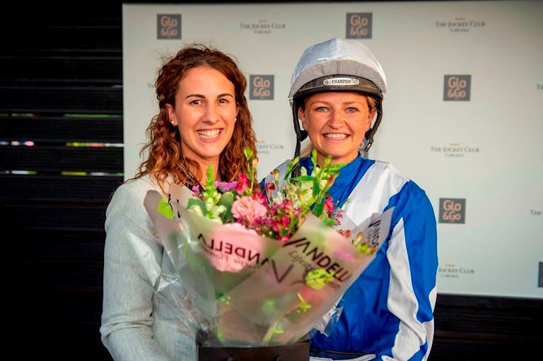 (7) Molly Dingwall presents flowers to Emma Sayer ahead of her final race.jpg