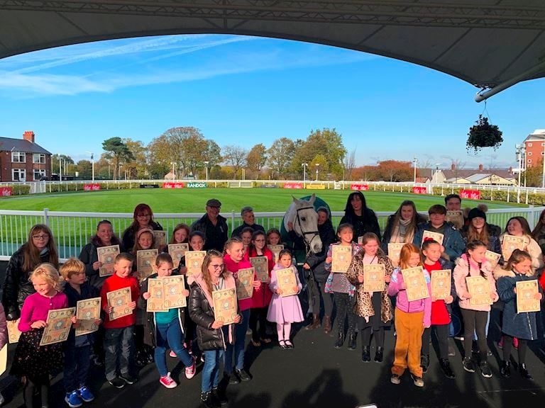 Neptune Collonges and children from Park Palace Ponies with their certificates in Aintree's Parade Ring1.jpg