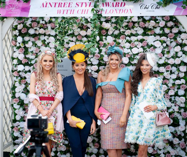 Four females against flower wall 2019.jpg