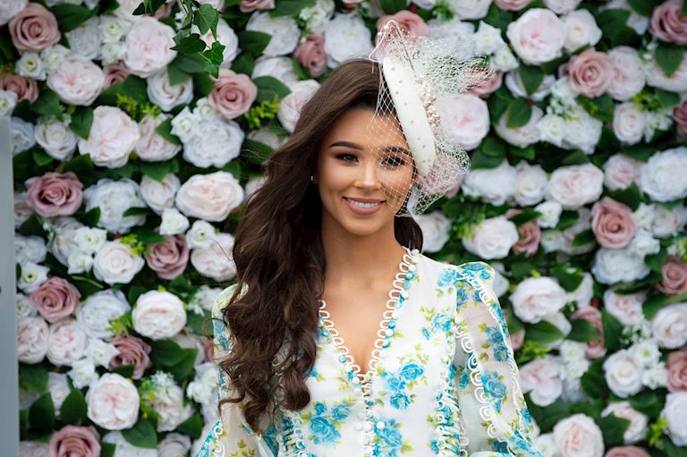 Racegoer against Aintree flower wall-min.jpg